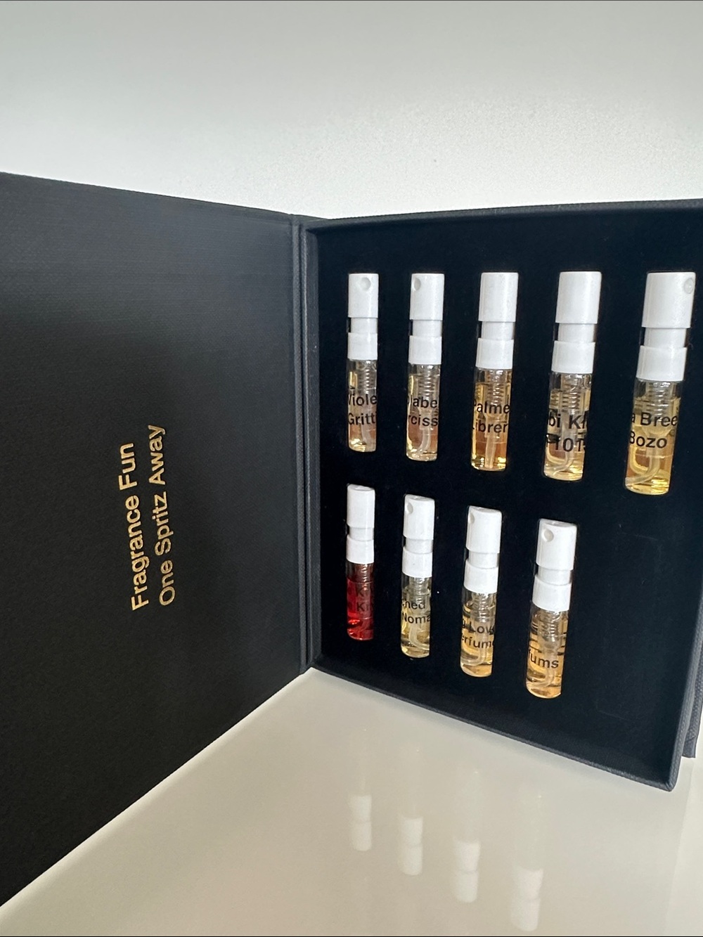 Parfums Exquis set of βpins,β high-end niche samples